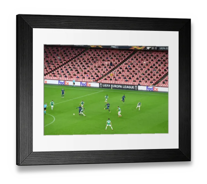 Framed Print : Great title! Here are some alternative suggestions: 1. Empty Seats and Europa League: Arsenal vs. Rapid Wien at Emirates Stadium (December 2020) 2. Ghostly Europa League: Arsenal's Emirates Stadium Showdown with Rapid Wien (December 2020) 3. Arsenal vs. Rapid Wien: A Silent Europa League Battle at Emirates Stadium (December 2020) 4. The Quiet Europa League: Arsenal and Rapid Wien Face Off at Emirates Stadium (December 2020) 5. Arsenal's Europa League Clash with Rapid Wien: A Game Behind Closed Doors (December 2020) 6. Arsenal vs. Rapid Wien: A Ghostly Europa League Encounter at Emirates Stadium (December 2020) 7. The Empty Stadium Europa League: Arsenal and Rapid Wien Battle it Out (December 2020) 8. Arsenal vs. Rapid Wien: A Europa League Showdown in an Empty Emirates Stadium (December 2020) 9. Arsenal's Europa League Match against Rapid Wien: A Game in an Empty Emirates Stadium (December 2020) 10. Arsenal vs. Rapid Wien: A Quiet Europa League Contest at Emirates Stadium (December 2020)