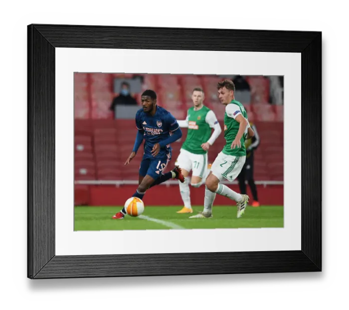 Framed Print : Arsenal vs Rapid Wien: Ainsley Maitland-Niles Clashes with Lion Schuster in Europa League Showdown