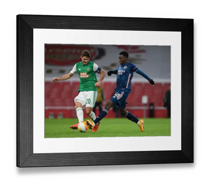 Framed Print : Arsenal vs Rapid Wien: Eddie Nketiah Clashes with Maximilian Hofmann in Europa League Showdown
