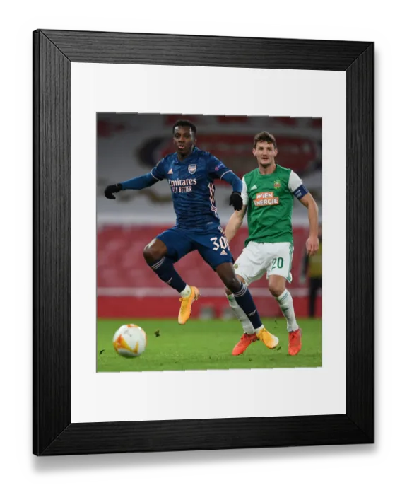 Framed Print : Arsenal's Eddie Nketiah in Action against Rapid Wien in Europa League Clash Framed Print : Arsenal's Eddie Nketiah in Action against Rapid Wien in Europa League Clash