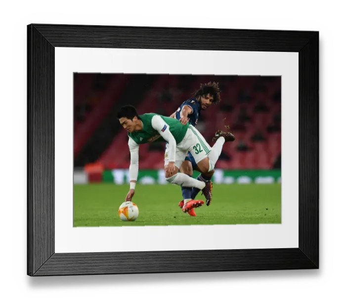 Framed Print : Arsenal vs Rapid Wien: Elneny Fouls in Europa League Clash Framed Print : Arsenal vs Rapid Wien: Elneny Fouls in Europa League Clash