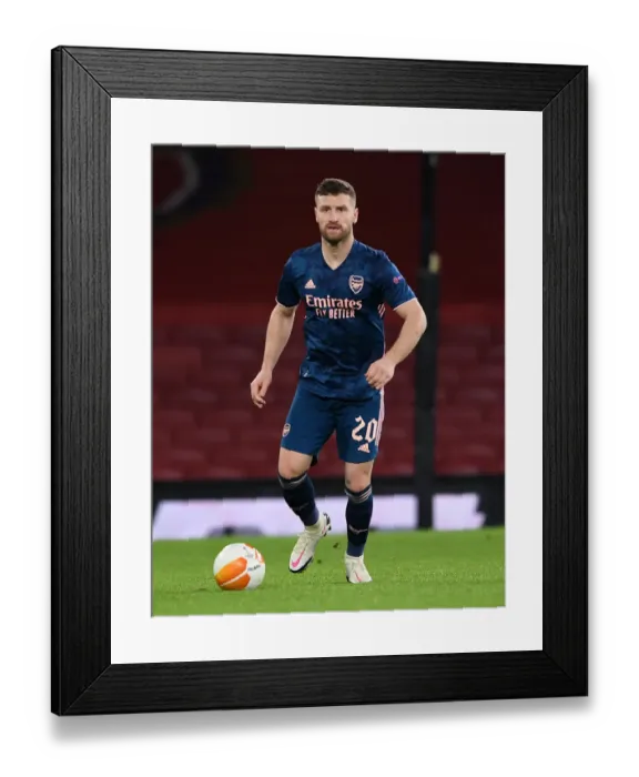 Framed Print : Arsenal's Mustafi in Action against Rapid Wien in Europa League Framed Print : Arsenal's Mustafi in Action against Rapid Wien in Europa League