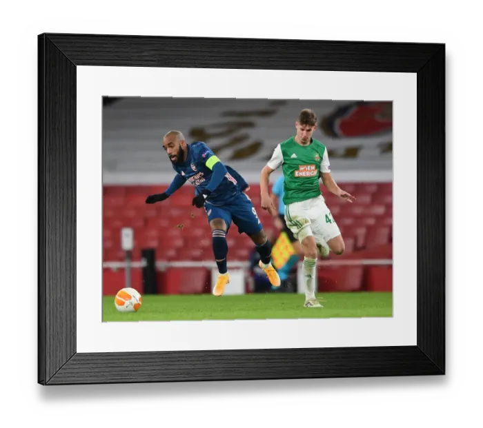 Framed Print : Arsenal's Lacazette Clashes with Rapid Wien's Schuster in Europa League Showdown