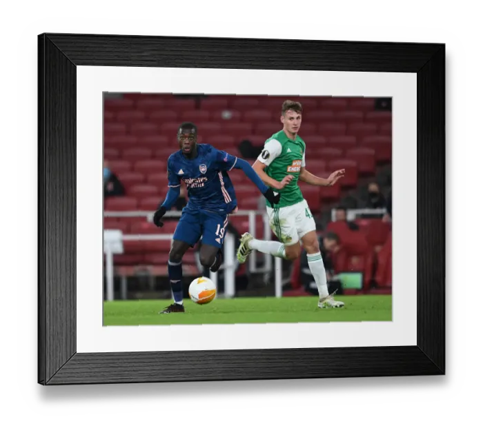 Framed Print : Arsenal's Pepe Clashes with Schuster in Europa League Battle at Emirates Stadium