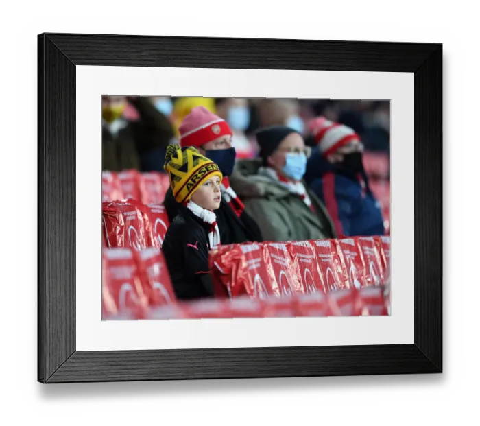 Framed Print : Arsenal Fans in Full Swing: Cheering at Emirates Stadium during Europa League Match Framed Print : Arsenal Fans in Full Swing: Cheering at Emirates Stadium during Europa League Match