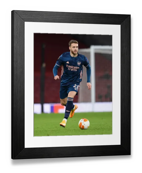 Framed Print : Arsenal's Calum Chambers in Action against Rapid Wien in Europa League Group Stage