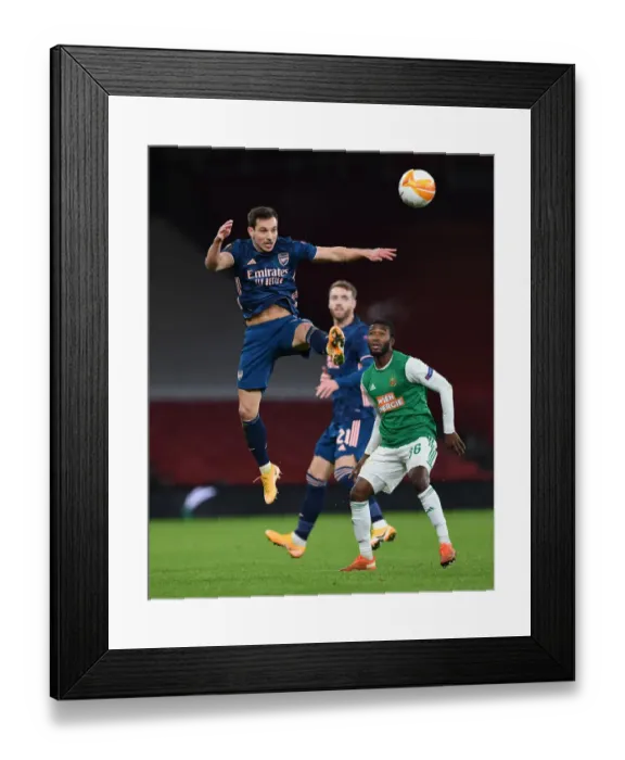 Framed Print : Arsenal vs Rapid Wien: Tense Moment as Cedric Soares Clears Ball in UEFA Europa League Clash Framed Print : Arsenal vs Rapid Wien: Tense Moment as Cedric Soares Clears Ball in UEFA Europa League Clash