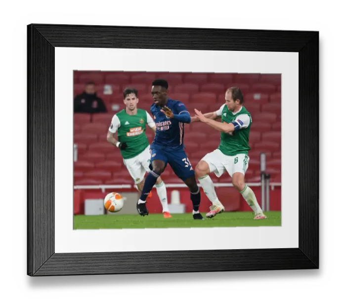 Framed Print : Arsenal vs Rapid Wien: Tense Moment in UEFA Europa League Clash