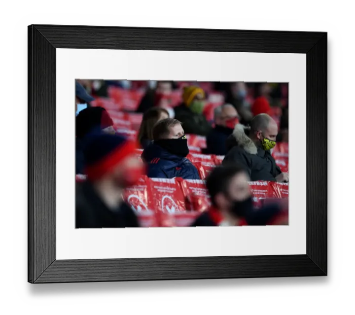 Framed Print : Arsenal FC vs Rapid Wien: A Passionate Arsenal Fan at Emirates Stadium, UEFA Europa League