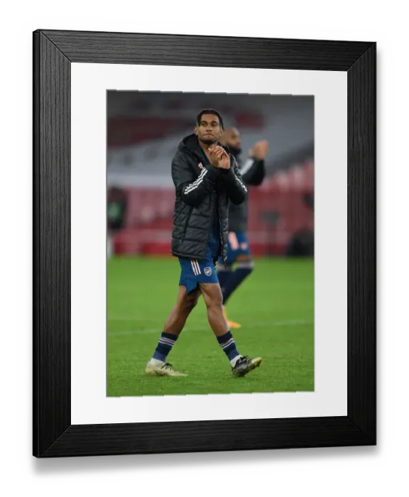 Framed Print : Arsenal's Reiss Nelson Celebrates Europa League Victory with a Clap for the Fans