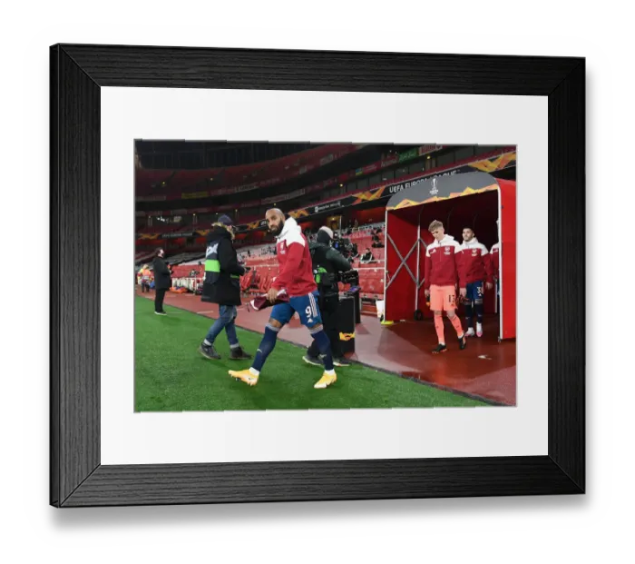 Framed Print : Arsenal's Alexandre Lacazette Leads Team Out Against Rapid Wien in Europa League Framed Print : Arsenal's Alexandre Lacazette Leads Team Out Against Rapid Wien in Europa League
