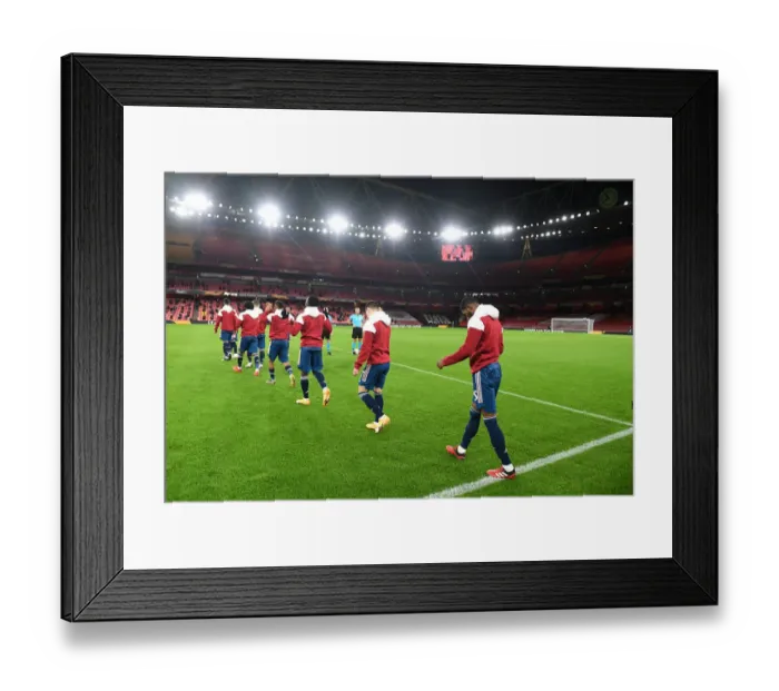 Framed Print : Arsenal Players Walk Out Before Europa League Clash Against Rapid Wien