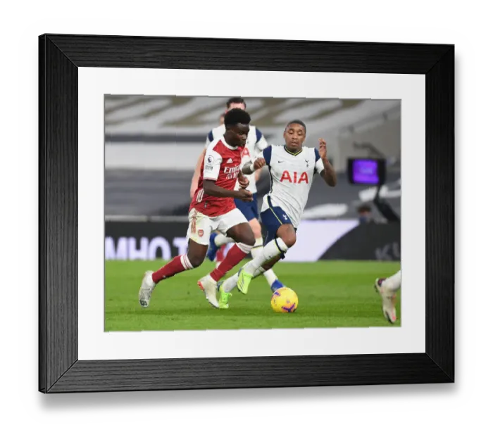 Framed Print : Bukayo Saka vs. Steven Bergwijn: Battle at the Tottenham Hotspur Stadium - Arsenal vs. Tottenham Premier League Clash (2020-21)