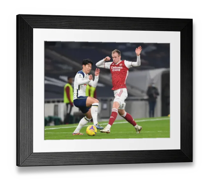 Framed Print : Rob Holding vs Son Heung-Min: A Premier League Showdown at Tottenham Hotspur Stadium, London, 2020 - Arsenal's Defender Stands Firm Against Tottenham's Star Forward