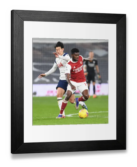 Framed Print : Thomas Partey's Dominance: Arsenal's Premier League Triumph Over Tottenham - Partey Outmuscles Son Heung-Min Framed Print : Thomas Partey's Dominance: Arsenal's Premier League Triumph Over Tottenham - Partey Outmuscles Son Heung-Min