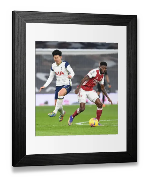 Framed Print : Thomas Partey Outsmarts Son Heung-Min: Arsenal's Triumph Over Tottenham in the Premier League 2020-21 Battle at Tottenham Hotspur Stadium Framed Print : Thomas Partey Outsmarts Son Heung-Min: Arsenal's Triumph Over Tottenham in the Premier League 2020-21 Battle at Tottenham Hotspur Stadium