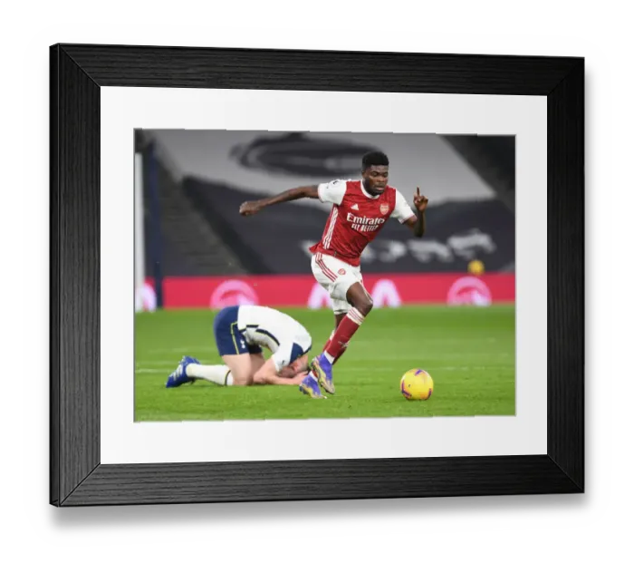 Framed Print : Thomas Partey's Powerful Surge: Arsenal's Triumph Over Tottenham Framed Print : Thomas Partey's Powerful Surge: Arsenal's Triumph Over Tottenham