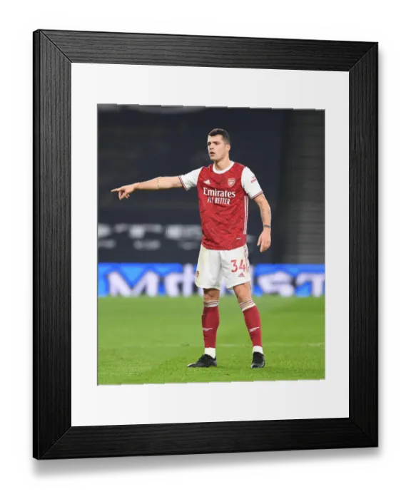 Framed Print : London Derby Showdown: Granit Xhaka in Action for Arsenal against Tottenham Hotspur, Premier League 2020-21 Framed Print : London Derby Showdown: Granit Xhaka in Action for Arsenal against Tottenham Hotspur, Premier League 2020-21
