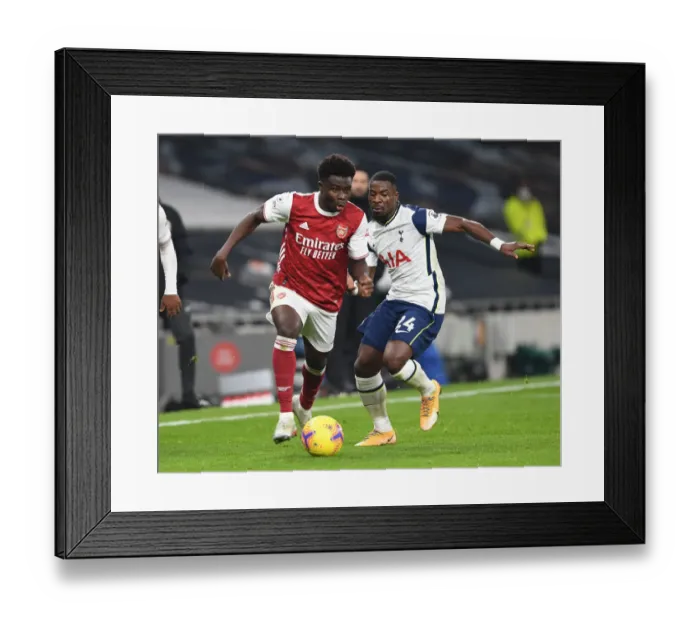 Framed Print : Bukayo Saka Breaks Past Aurier: Tottenham vs. Arsenal, Premier League 2020-21