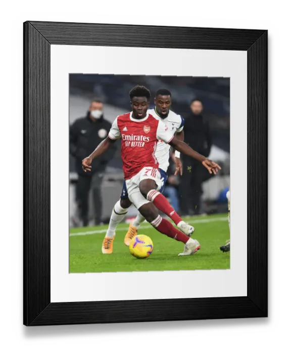 Framed Print : Arsenal's Bukayo Saka in Action against Tottenhotspur in 2020-21 Premier League Framed Print : Arsenal's Bukayo Saka in Action against Tottenhotspur in 2020-21 Premier League