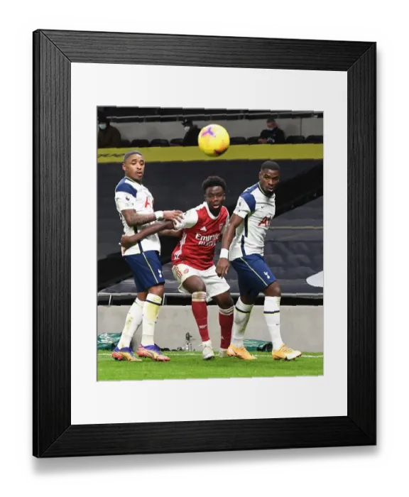 Framed Print : Bukayo Saka Faces Off Against Bergwijn and Aurier in Tottenham vs Arsenal Premier League Clash, 2020-21