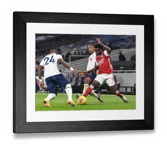Framed Print : Tottenham vs Arsenal: Bukayo Saka Faces Off Against Bergwijn and Aurier in the Premier League