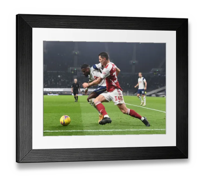 Framed Print : Clash of the London Rivals: Xhaka vs. Aurier - Battle at the Tottenham Hotspur Stadium