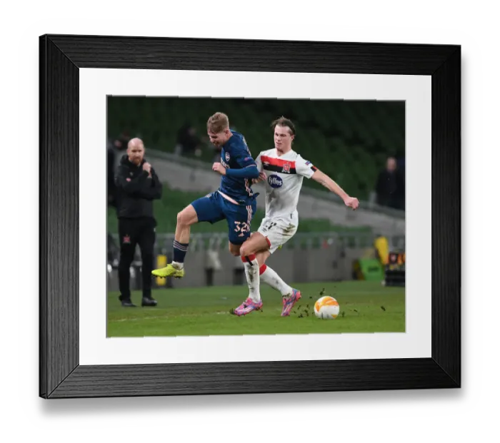 Framed Print : Emile Smith Rowe vs Dan Cleary: Intense Clash in Arsenal's UEFA Europa League Match against Dundalk FC