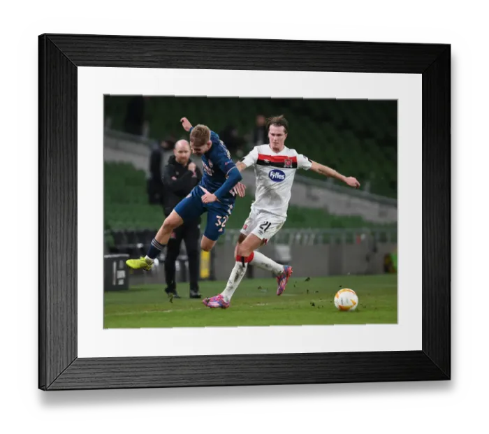 Framed Print : Emile Smith Rowe vs Dan Cleary: Clash in UEFA Europa League Match between Dundalk and Arsenal Framed Print : Emile Smith Rowe vs Dan Cleary: Clash in UEFA Europa League Match between Dundalk and Arsenal