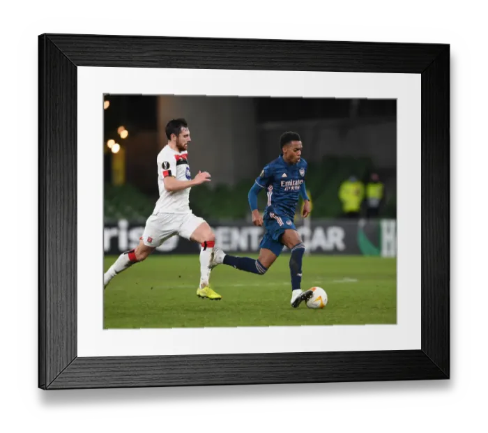 Framed Print : Joe Willock Breaks Past Dundalk's Jordan Flores: Arsenal's Europa League Victory Against Dundalk FC (December 2020)