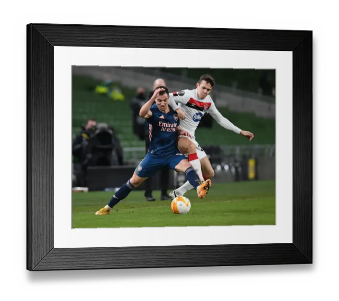 Framed Print : Arsenal's Cedric Overpowers Dundalk's James Wynne in UEFA Europa League Clash Framed Print : Arsenal's Cedric Overpowers Dundalk's James Wynne in UEFA Europa League Clash