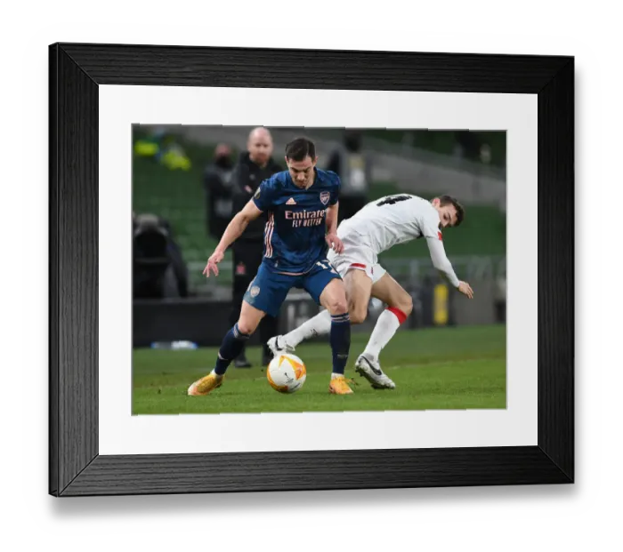 Framed Print : Arsenal's Cedric Overpowers Dundalk's Wynne in Europa League Clash