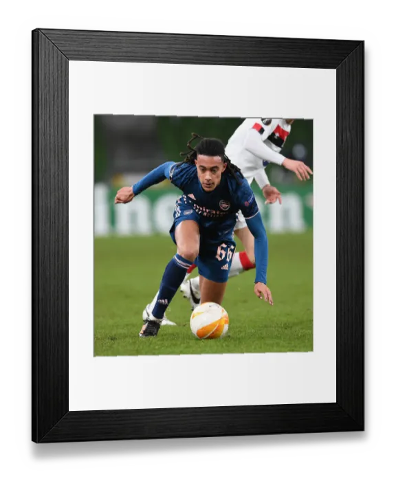 Framed Print : Arsenal's Miguel Azeez Storms Past Dundalk: UEFA Europa League Clash
