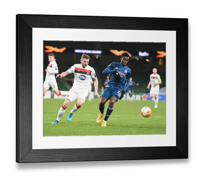 Framed Print : Arsenal's Eddie Nketiah Faces Off Against Dundalk's Andy Boyle in UEFA Europa League Clash