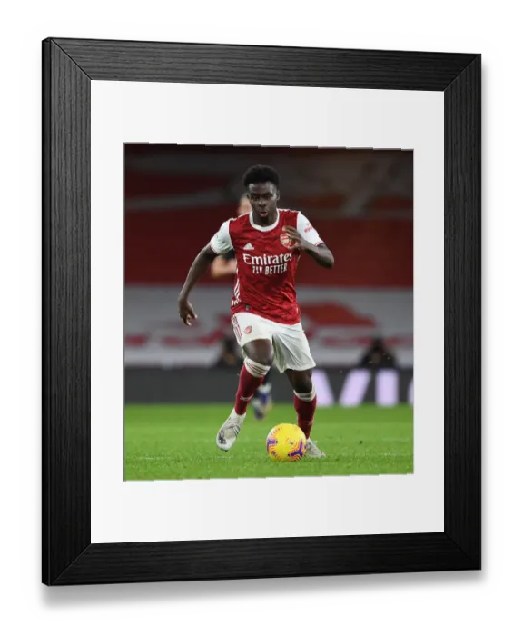 Framed Print : Arsenal's Bukayo Saka Shines in Limited-Capacity Premier League Clash Against Burnley Framed Print : Arsenal's Bukayo Saka Shines in Limited-Capacity Premier League Clash Against Burnley
