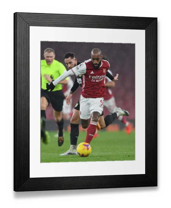 Framed Print : Arsenal vs Burnley: Lacazette Faces Off Against Brownhill in Premier League Clash