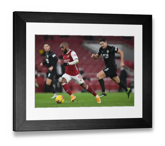 Framed Print : Arsenal's Lacazette Clashes with Burnley's Tarkowski in Premier League Showdown