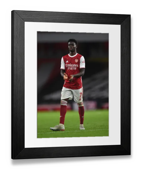 Framed Print : Arsenal's Bukayo Saka Celebrates with Fans after Arsenal v Burnley Victory (2020-21) Framed Print : Arsenal's Bukayo Saka Celebrates with Fans after Arsenal v Burnley Victory (2020-21)