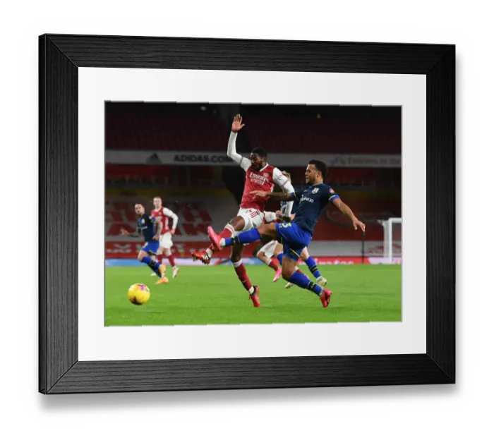 Framed Print : Arsenal vs Southampton: Ainsley Maitland-Niles vs Ryan Bertrand Clash in Empty Emirates Stadium (Premier League 2020-21)