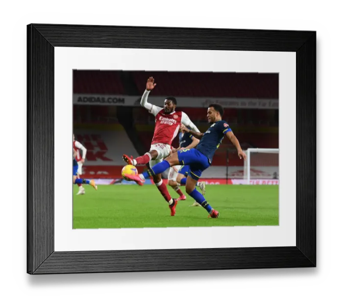 Framed Print : Arsenal vs. Southampton: Maitland-Niles vs. Bertrand Clash in Empty Emirates Stadium - Premier League 2020-21 Framed Print : Arsenal vs. Southampton: Maitland-Niles vs. Bertrand Clash in Empty Emirates Stadium - Premier League 2020-21