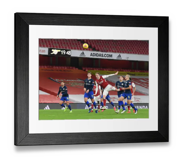 Framed Print : Arsenal vs Southampton: Holding's Header Hits the Crossbar in Empty Emirates Stadium Framed Print : Arsenal vs Southampton: Holding's Header Hits the Crossbar in Empty Emirates Stadium