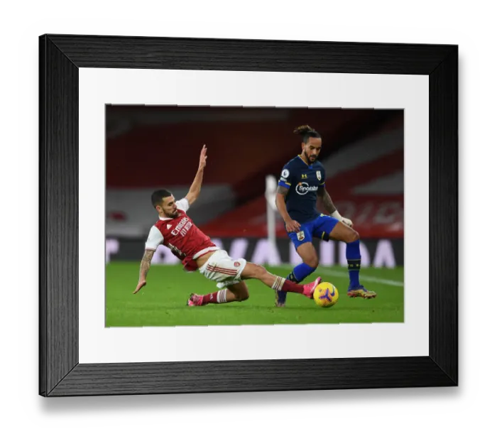 Framed Print : Arsenal vs Southampton: Ceballos Tackles Walcott in Intense Premier League Clash