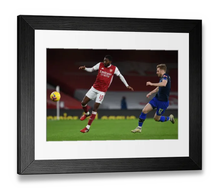 Framed Print : Intense Rivalry: Maitland-Niles vs. Armstrong's Battle for Ball Possession, Arsenal vs. Southampton, Premier League 2020-21