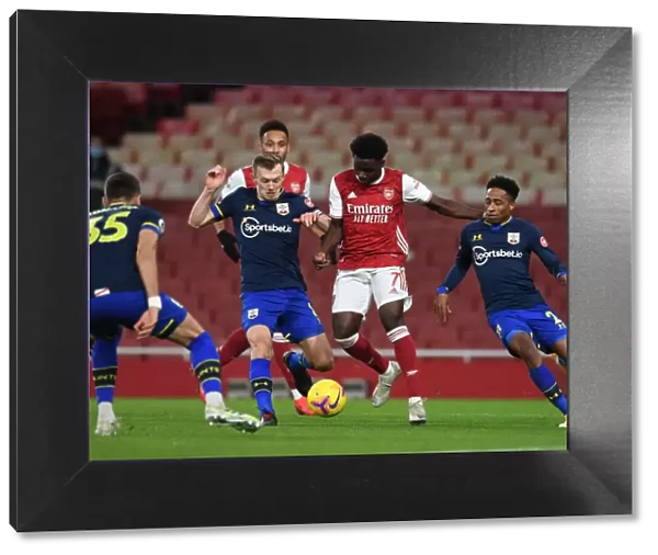 Arsenal's Bukayo Saka Faces Off Against Southampton's Ward-Prowse and Walker-Peters in Intense Premier League Showdown