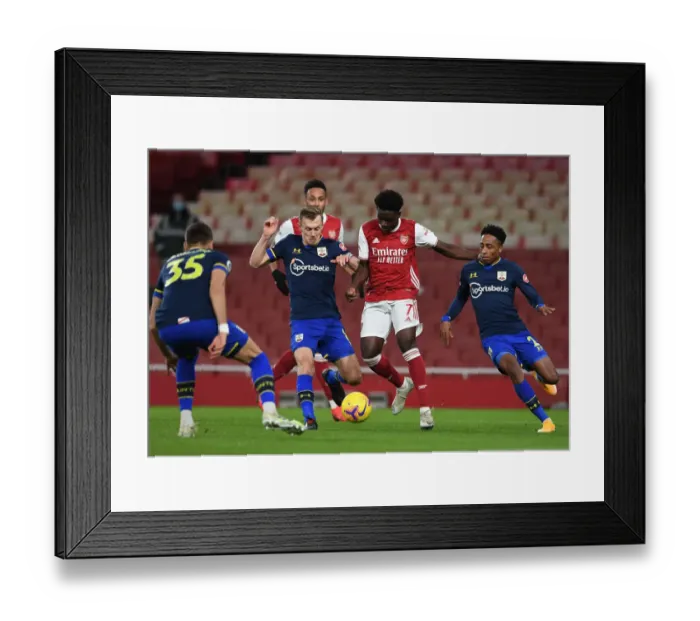 Framed Print : Arsenal's Bukayo Saka Faces Off Against Southampton's Ward-Prowse and Walker-Peters in Intense Premier League Showdown