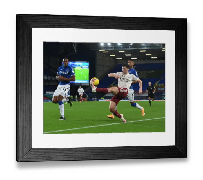 Framed Print : Arsenal's Kieran Tierney Faces Off Against Everton's Mina and Holgate in Premier League Clash