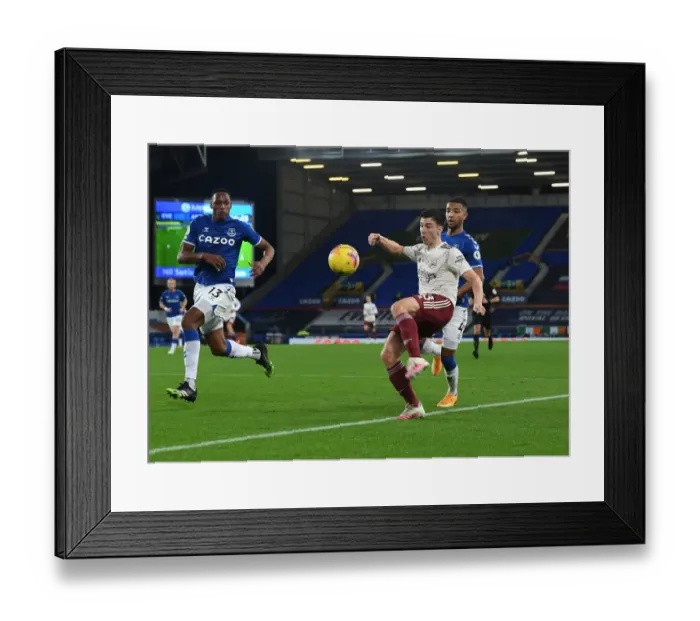 Framed Print : Arsenal's Kieran Tierney Clashes with Everton's Mina and Holgate in Premier League Showdown