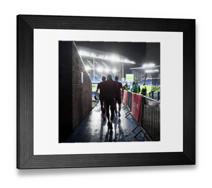 Framed Print : Arsenal Players Warm Up Ahead of Everton Clash in Premier League