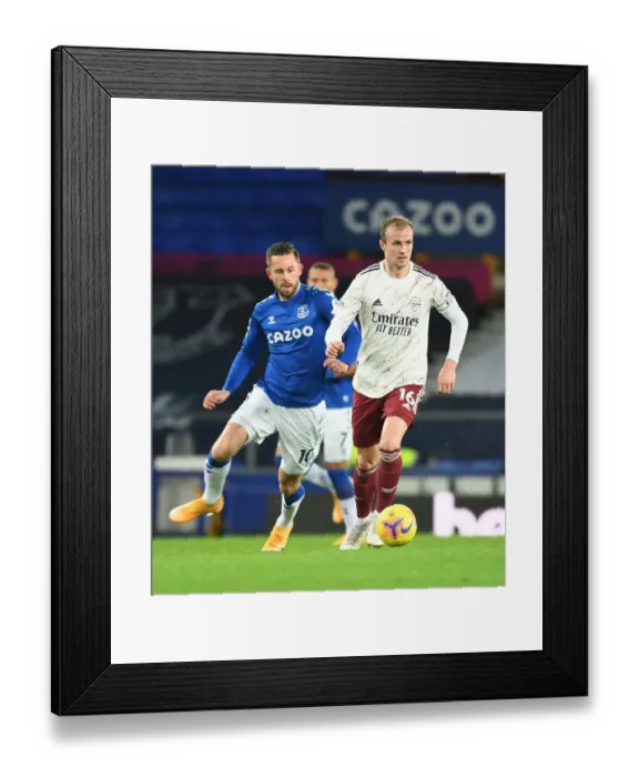 Framed Print : Rising Above: Holding Outsmarts Sigurdsson in Everton vs Arsenal Clash (Premier League 2020-21)
