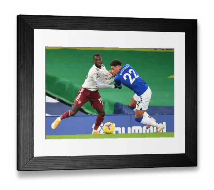 Framed Print : Pepe vs Godfrey: Intense Battle at Goodison Park - Everton vs Arsenal, Premier League 2020-21